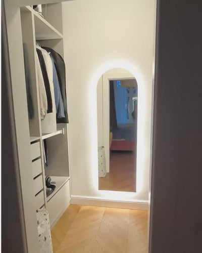 Arched LED mirror in the dressing room